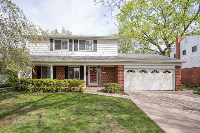 traditional home with an attached garage, brick siding, driveway, and a front lawn