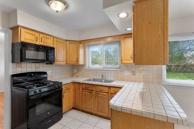 29458 Walker Dr, Warren, MI 48092 - kitchen featuring black appliances, a sink, tile countertops, tasteful backsplash, and recessed lighting