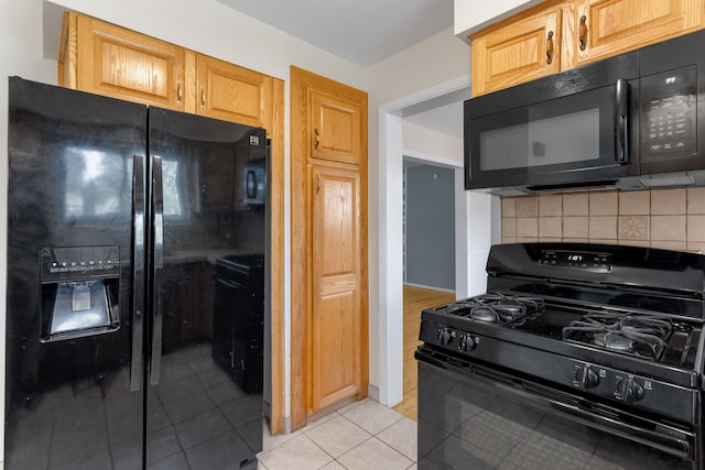 29458 Walker Dr, Warren, MI 48092 - kitchen featuring black appliances, decorative backsplash, and light tile patterned flooring