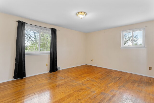29458 Walker Dr, Warren, MI 48092 - unfurnished room with healthy amount of natural light, light wood-style flooring, and baseboards