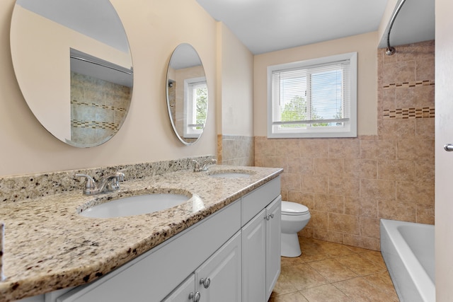 29458 Walker Dr, Warren, MI 48092 - bathroom with tile walls, toilet, tile patterned flooring, double vanity, and a wainscoted wall