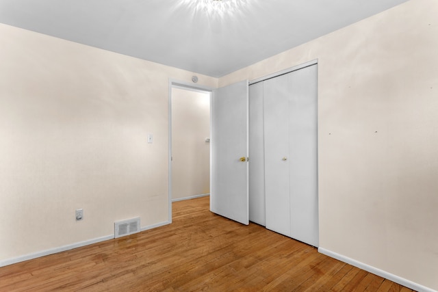 29458 Walker Dr, Warren, MI 48092 - unfurnished bedroom with wood finished floors, a closet, and baseboards