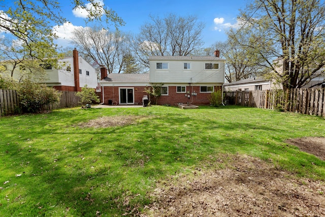 29458 Walker Dr, Warren, MI 48092 - back of house featuring brick siding, a chimney, and a patio area