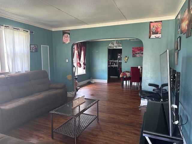 752 E Philadelphia Blvd, Flint, MI 48505 - living room featuring arched walkways, crown molding, wood finished floors, and baseboards