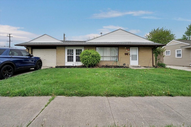 single story home with an attached garage, brick siding, and a front yard