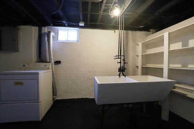 basement featuring washer / dryer and electric panel