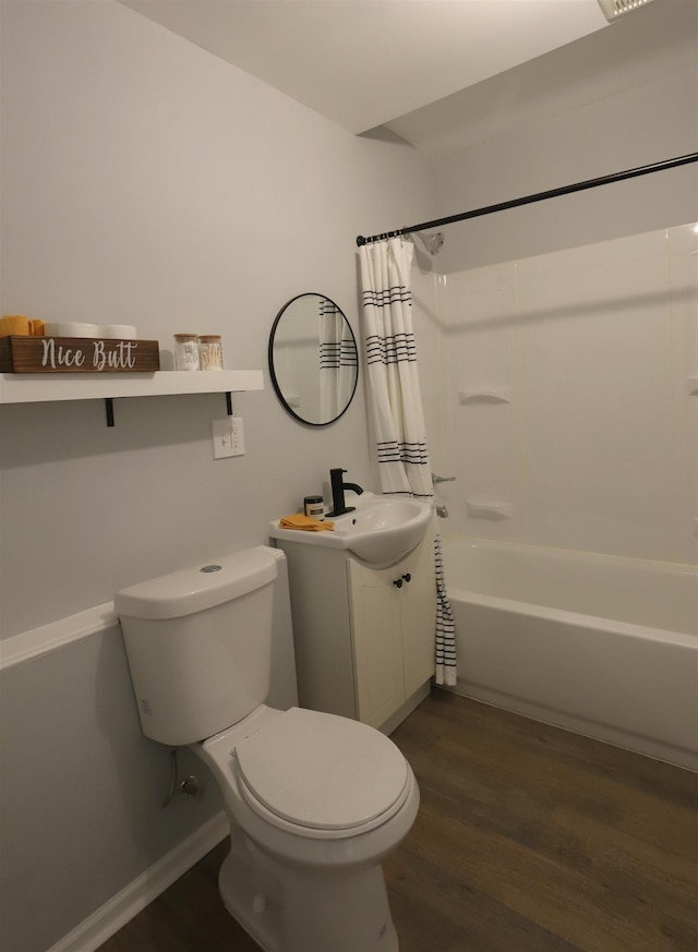 full bathroom featuring wood finished floors, toilet, vanity, and shower / bath combo with shower curtain