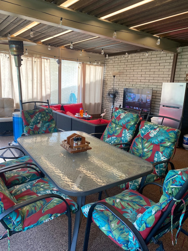 view of patio / terrace featuring outdoor dining area and an outdoor hangout area