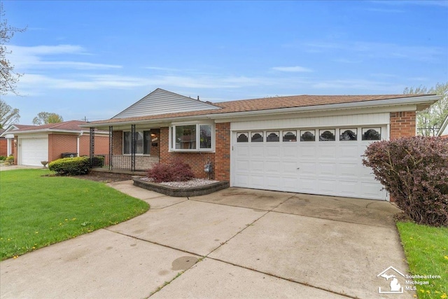 single story home featuring brick siding, concrete driveway, an attached garage, and a front yard