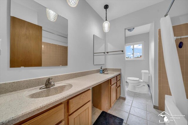bathroom with toilet, tile patterned floors, double vanity, and a shower with shower curtain