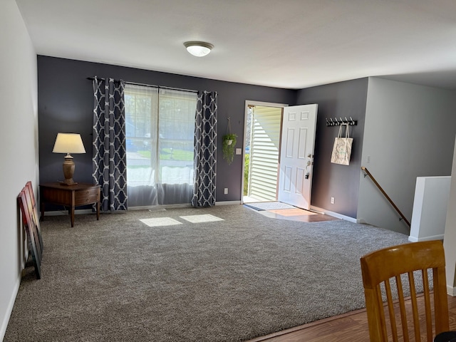 living room with baseboards and carpet floors
