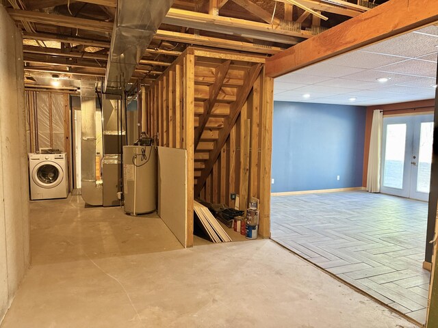 basement featuring washer / clothes dryer, water heater, heating unit, baseboards, and recessed lighting