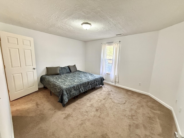 2184 Sugaridge Dr, Muskegon, MI 49445 - bedroom featuring carpet floors, baseboards, and a textured ceiling