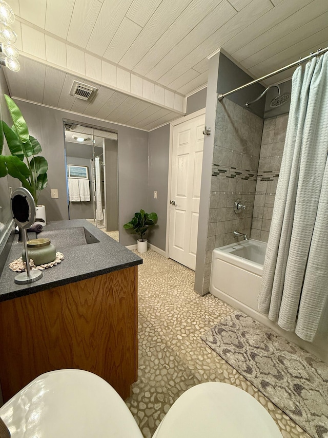 bathroom featuring shower / bath combo with shower curtain, vanity, toilet, and wood ceiling