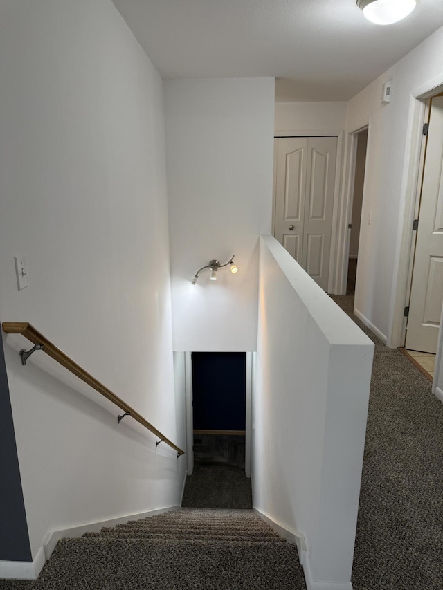 staircase with carpet flooring and baseboards