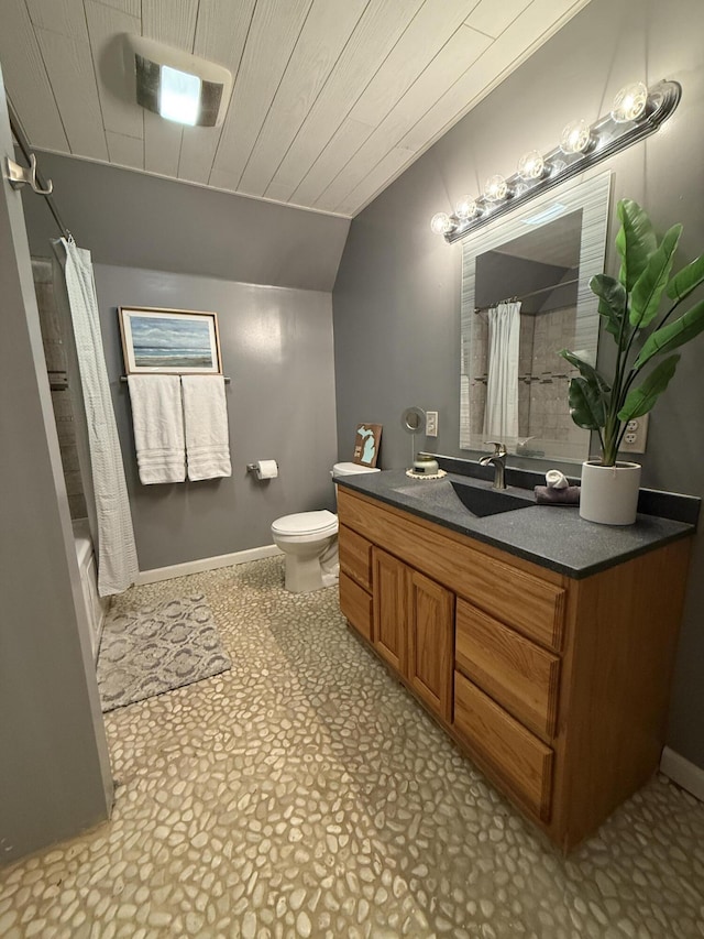 bathroom with vaulted ceiling, toilet, wood ceiling, vanity, and baseboards