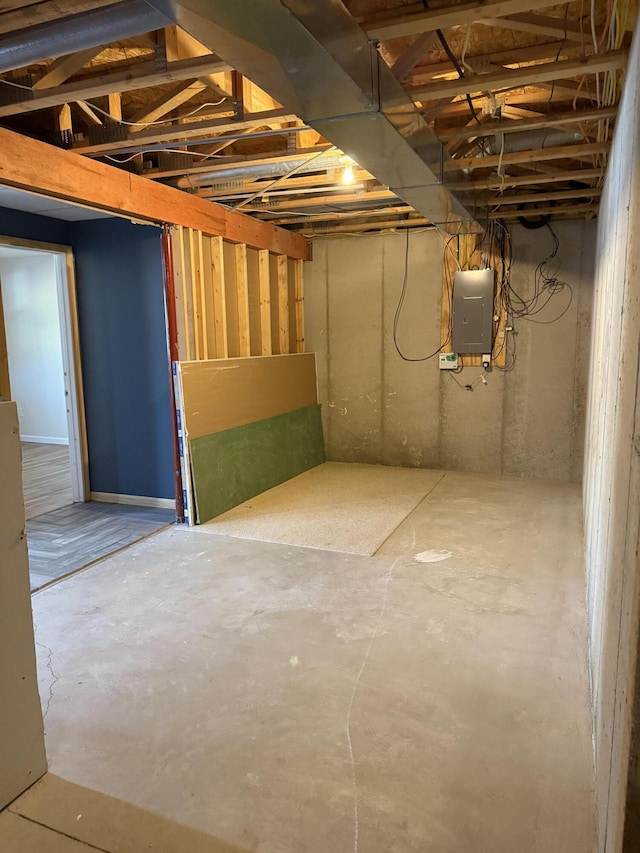 unfinished below grade area with electric panel