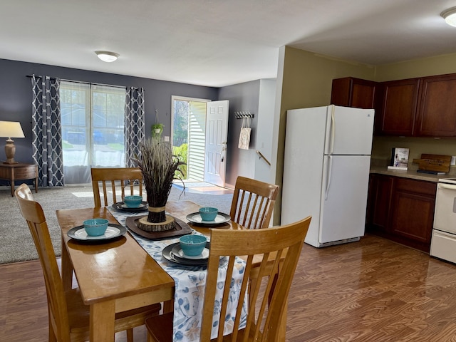 dining room with dark wood-style flooring