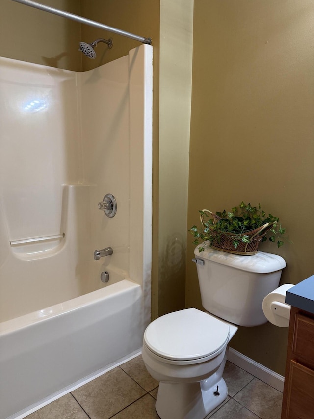 2184 Sugaridge Dr, Muskegon, MI 49445 - full bathroom featuring tile patterned floors, toilet, vanity, washtub / shower combination, and baseboards