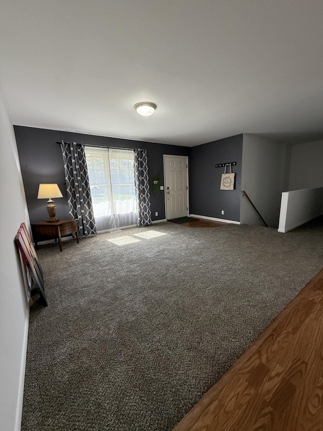 unfurnished living room with carpet