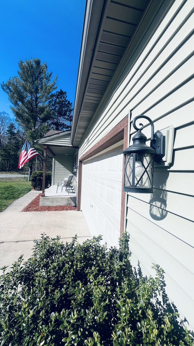 view of side of property featuring a garage