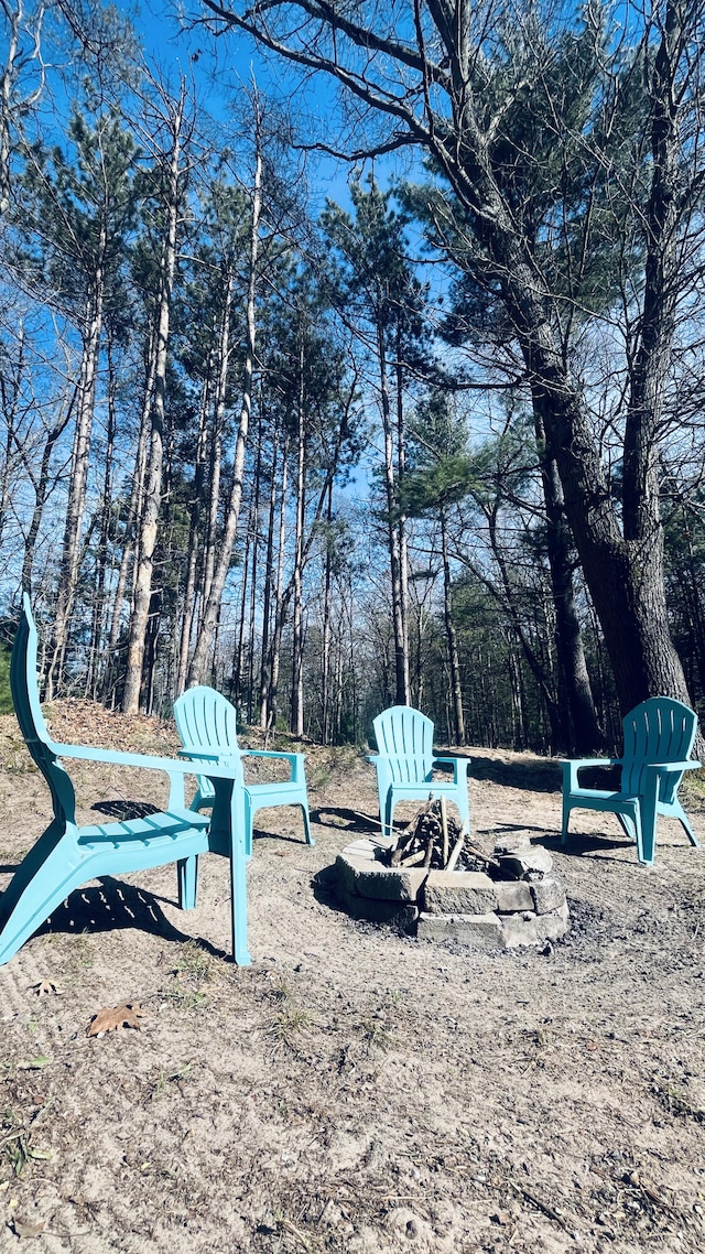 view of yard featuring a fire pit