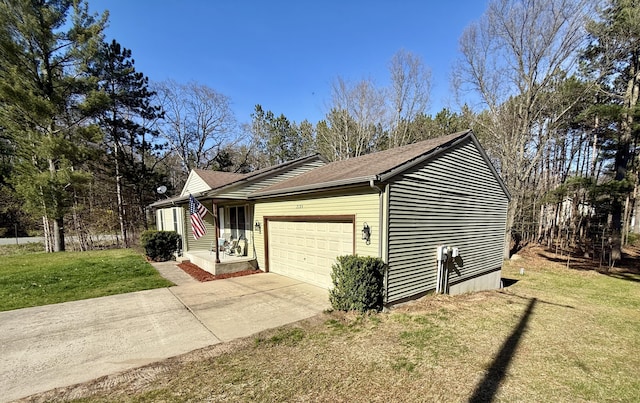 2184 Sugaridge Dr, Muskegon, MI 49445 - view of side of property with an attached garage, a yard, driveway, and roof with shingles