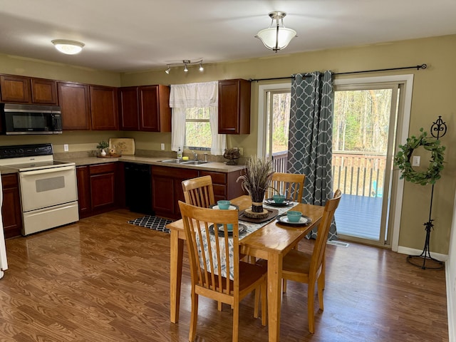 2184 Sugaridge Dr, Muskegon, MI 49445 - kitchen with stainless steel microwave, white electric stove, dishwasher, a sink, and light countertops