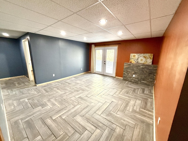 spare room with french doors, baseboards, and recessed lighting