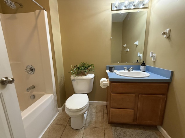 full bathroom featuring tile patterned floors, toilet, vanity, washtub / shower combination, and baseboards