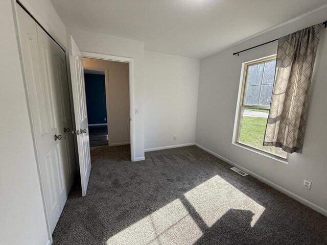 2184 Sugaridge Dr, Muskegon, MI 49445 - unfurnished bedroom with carpet and baseboards