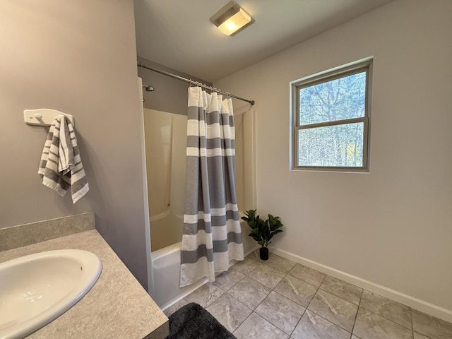 bathroom featuring shower / tub combo with curtain, baseboards, and vanity