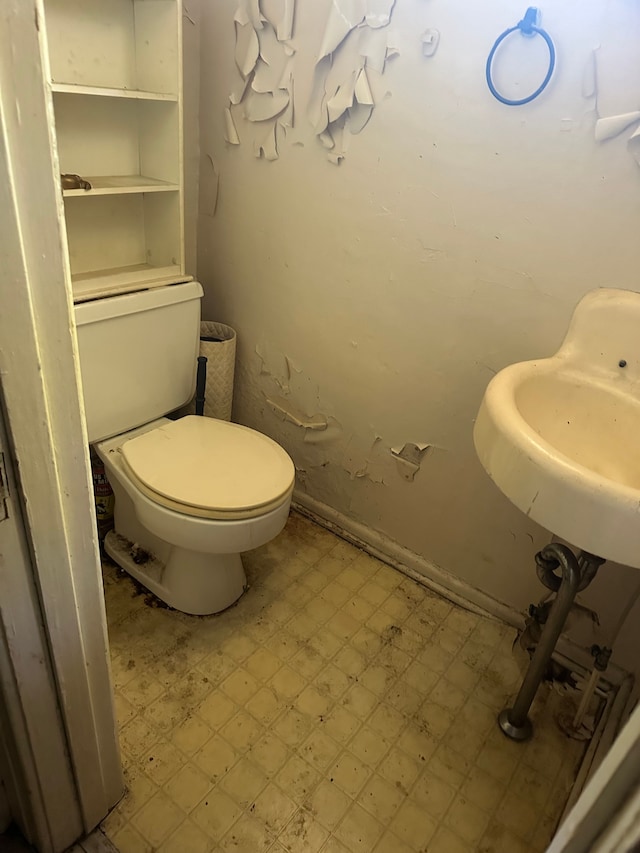 bathroom featuring tile patterned floors and toilet