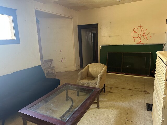 living area featuring tile patterned floors