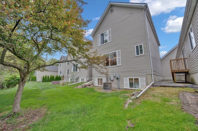 4661 Christopher Pines Dr, Clarkston, MI 48346 - back of house with a yard and central AC