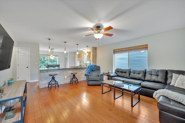 4661 Christopher Pines Dr, Clarkston, MI 48346 - living area featuring a ceiling fan and light wood-style floors