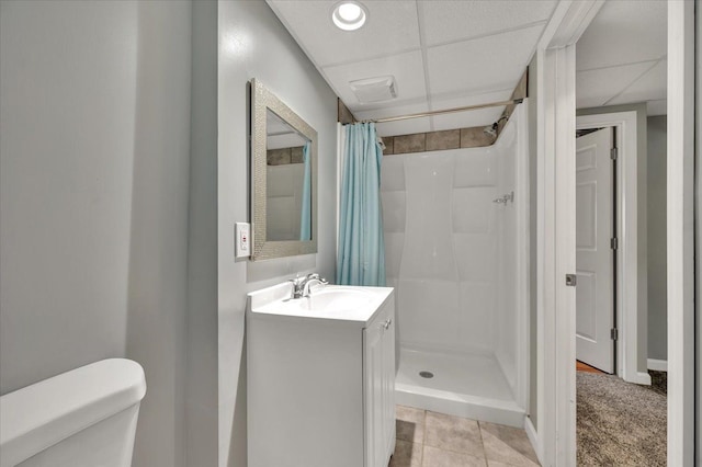 4661 Christopher Pines Dr, Clarkston, MI 48346 - bathroom with a shower stall, toilet, vanity, tile patterned flooring, and a drop ceiling