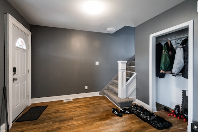 219 Waverly St, Highland Park, MI 48203 - entrance foyer with wood finished floors, stairs, and baseboards