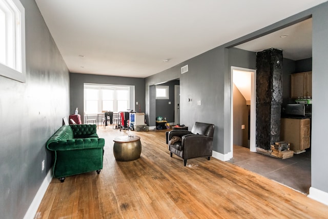 219 Waverly St, Highland Park, MI 48203 - living area with baseboards and hardwood / wood-style flooring
