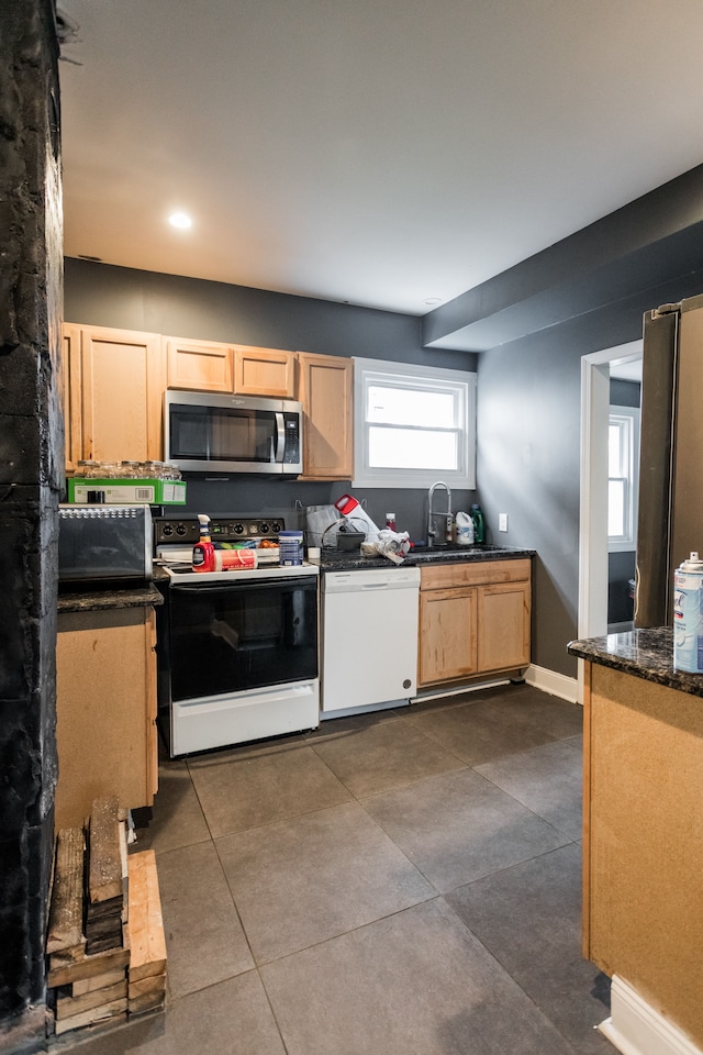 219 Waverly St, Highland Park, MI 48203 - kitchen featuring stainless steel microwave, range with electric stovetop, dishwasher, a sink, and light brown cabinets