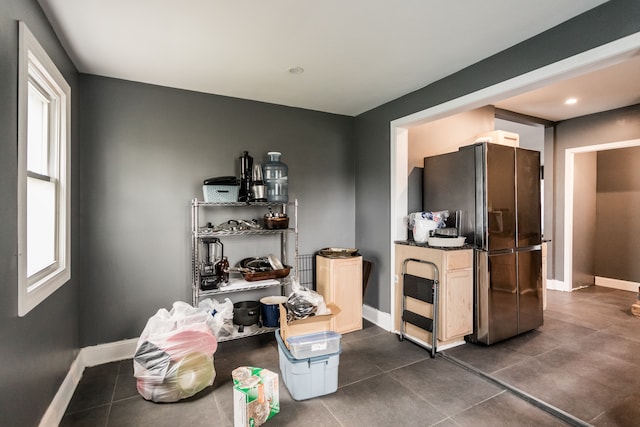 219 Waverly St, Highland Park, MI 48203 - kitchen with freestanding refrigerator, dark tile patterned floors, baseboards, and recessed lighting
