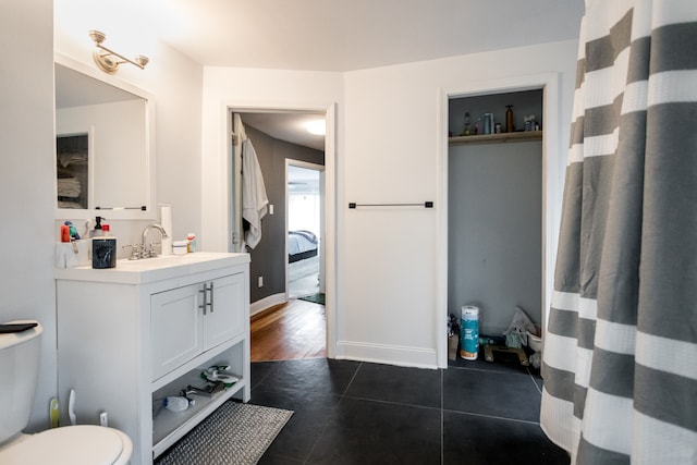 219 Waverly St, Highland Park, MI 48203 - bathroom featuring tile patterned flooring, vanity, toilet, and baseboards