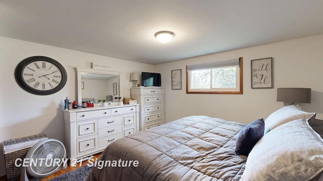 bedroom with wood finished floors