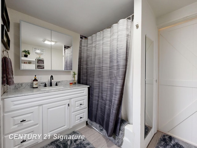 bathroom with vanity and a shower with curtain