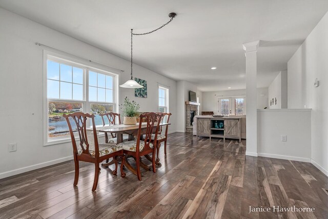 dining area with dark wood finished floors, baseboards, and recessed lighting