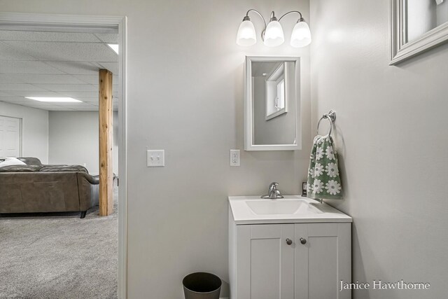 bathroom with vanity and a drop ceiling