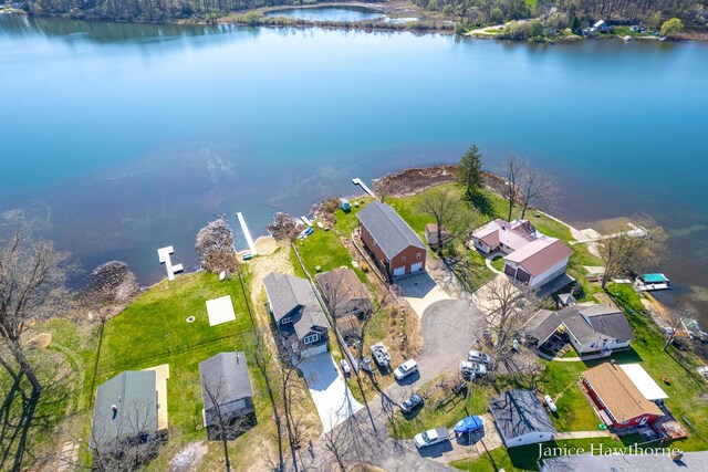 view of property location featuring nearby suburban area and a nearby body of water