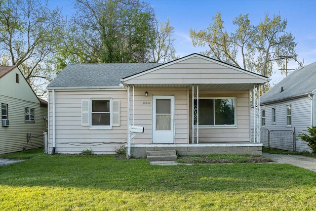 12855 Couwlier Ave, Warren, MI 48089 - view of front of property featuring covered porch, a front yard, and a shingled roof