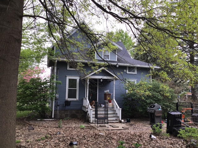 view of front of house featuring fence
