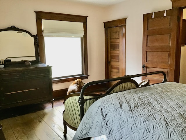 bedroom with wood-type flooring
